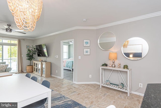 living room featuring ceiling fan with notable chandelier and crown molding