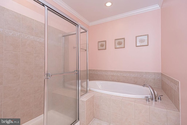 bathroom with crown molding and independent shower and bath