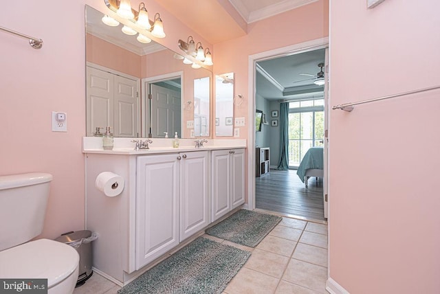 bathroom with vanity, toilet, wood-type flooring, and ceiling fan