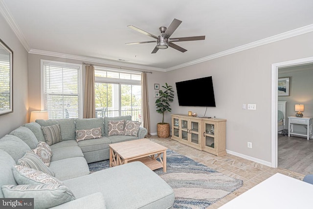 living area featuring ceiling fan, baseboards, and ornamental molding