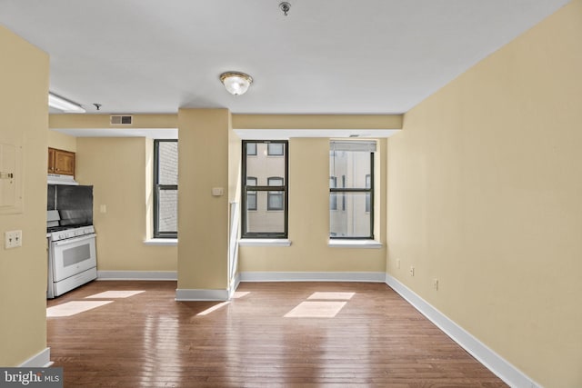 interior space with gas range gas stove and light hardwood / wood-style floors