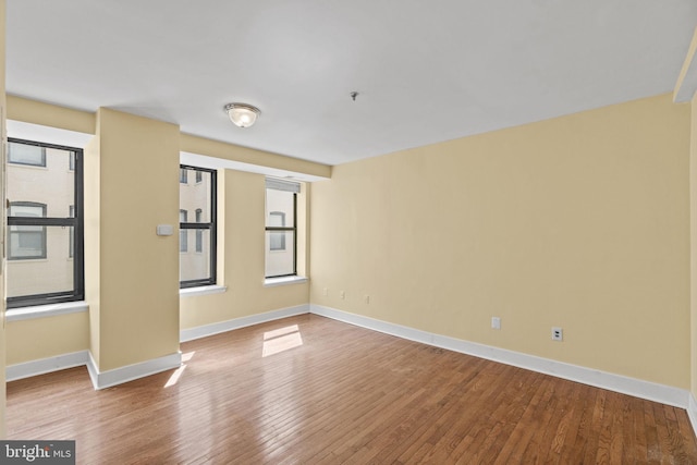 empty room featuring hardwood / wood-style flooring