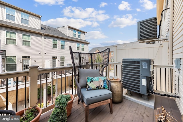 wooden terrace with a residential view and central AC