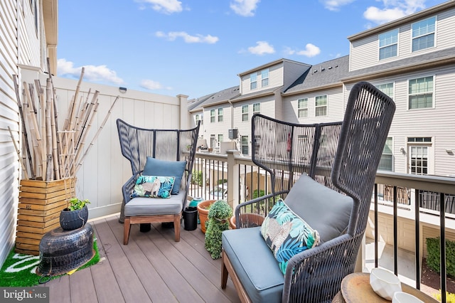 wooden deck with a residential view