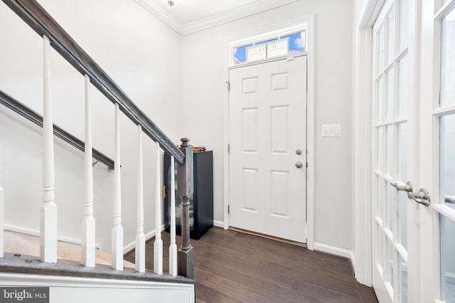 entrance foyer with stairway, baseboards, dark wood-style flooring, and ornamental molding