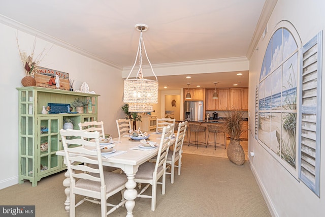 carpeted dining space featuring ornamental molding