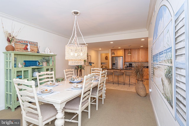 carpeted dining area with ornamental molding