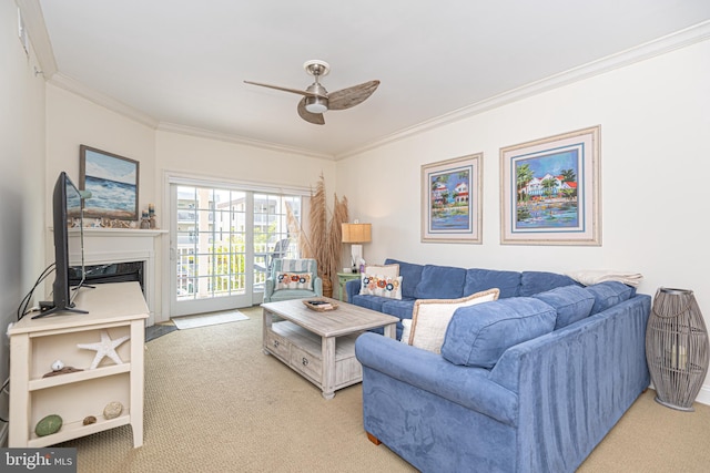 living area with ceiling fan, a fireplace with flush hearth, carpet, and ornamental molding