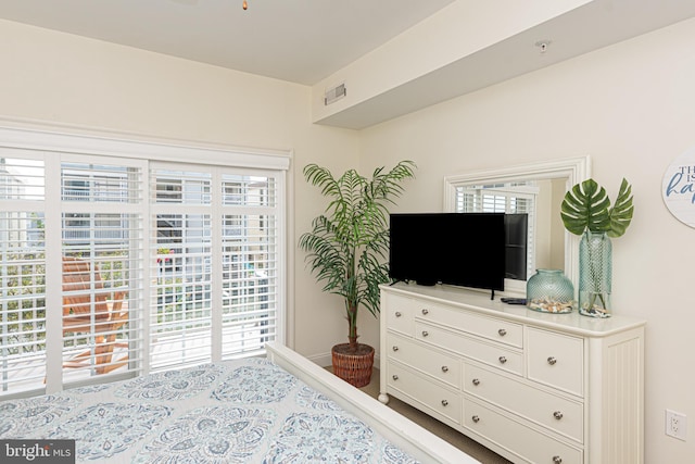 bedroom featuring visible vents