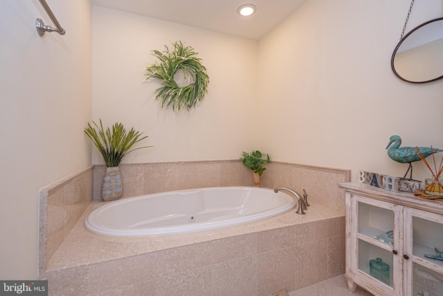 bathroom with tiled tub