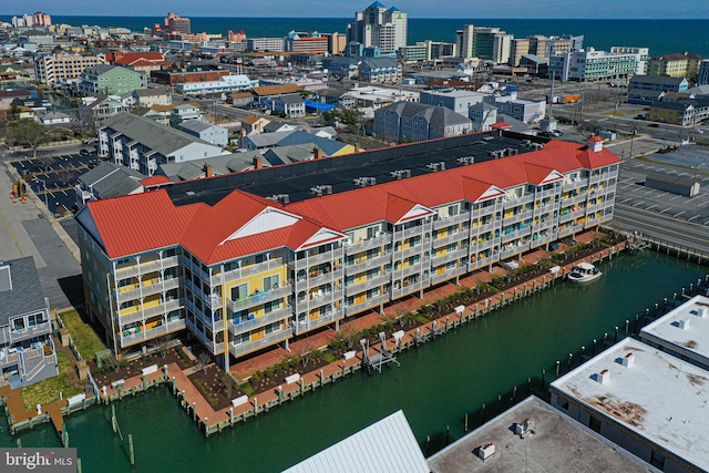 aerial view with a city view and a water view