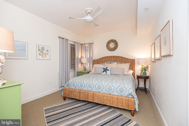 carpeted bedroom with baseboards and ceiling fan