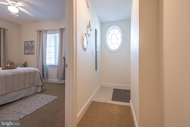 carpeted bedroom featuring ceiling fan