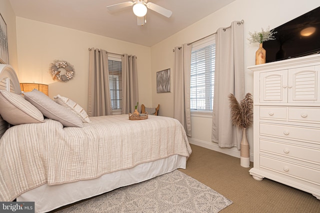 bedroom with baseboards, ceiling fan, and carpet floors