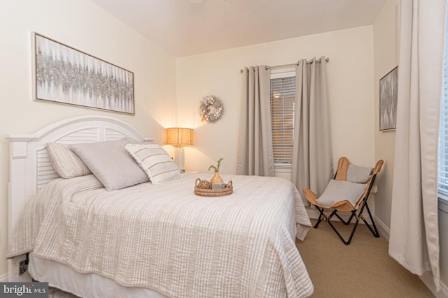 carpeted bedroom with baseboards