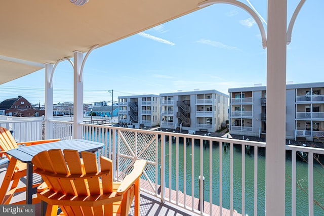 balcony featuring a water view