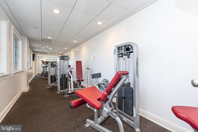 workout area featuring a paneled ceiling