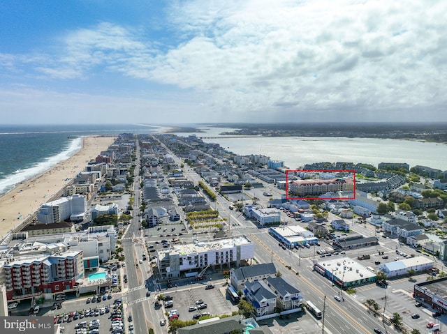 aerial view with a beach view and a water view