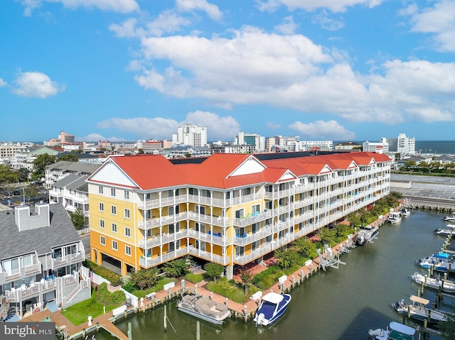 view of building exterior with a city view and a water view