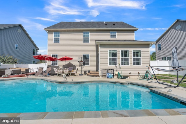 view of swimming pool with a patio