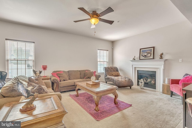 living room featuring ceiling fan and carpet flooring