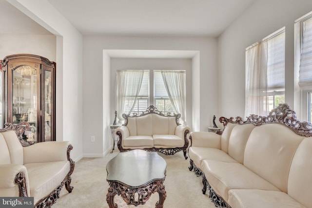 living room featuring light carpet and plenty of natural light