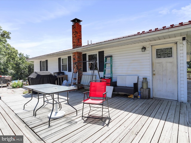 wooden terrace with grilling area