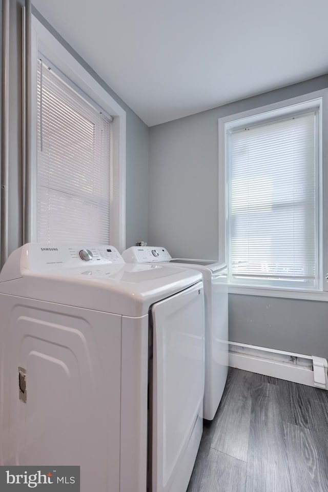 washroom featuring dark hardwood / wood-style flooring and washer and dryer