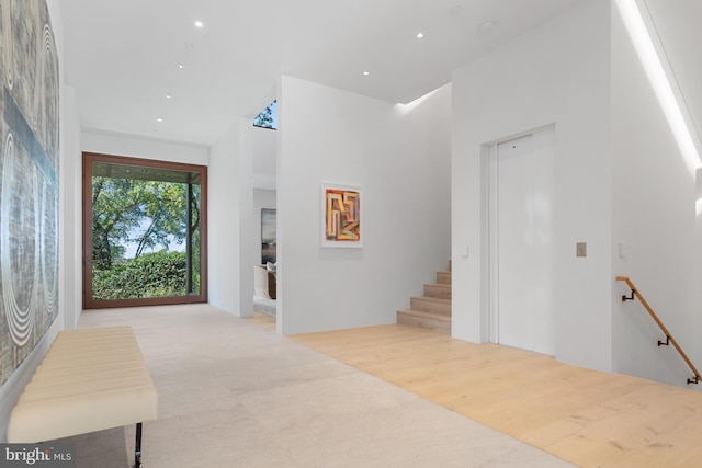 foyer entrance with light wood-type flooring