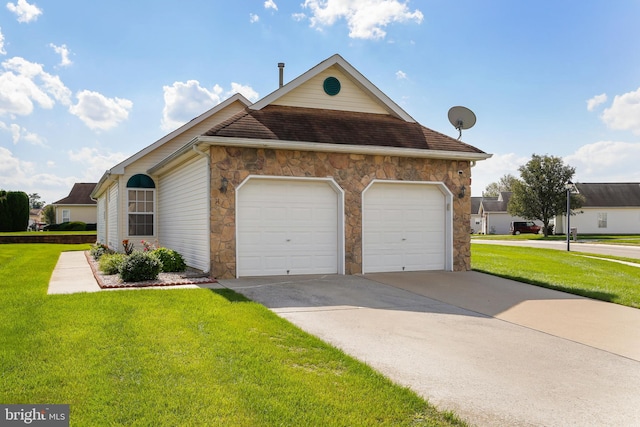 view of front facade with a front yard and a garage