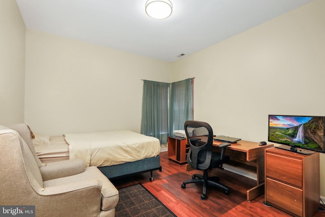 bedroom featuring wood-type flooring