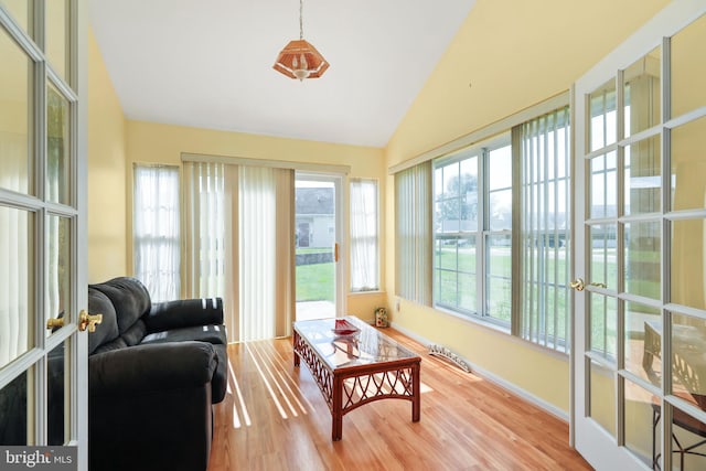 sunroom featuring lofted ceiling