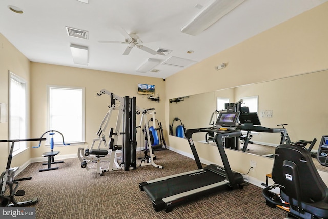 exercise room with carpet floors and ceiling fan