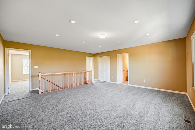 unfurnished room featuring carpet