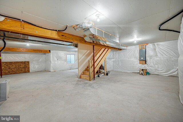 basement featuring heating unit and water heater