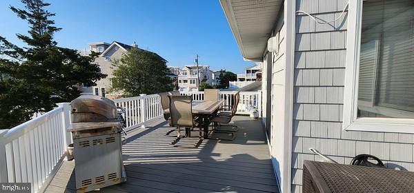 wooden deck featuring grilling area