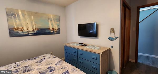 bedroom featuring dark hardwood / wood-style flooring