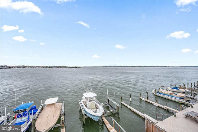 view of dock with a water view and boat lift