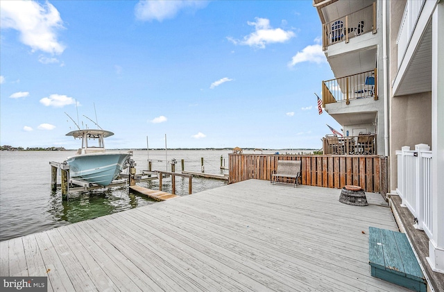 view of dock with a water view and boat lift