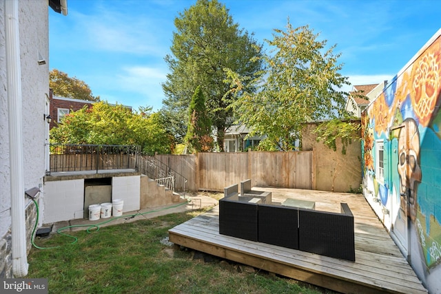 view of yard featuring a wooden deck and outdoor lounge area