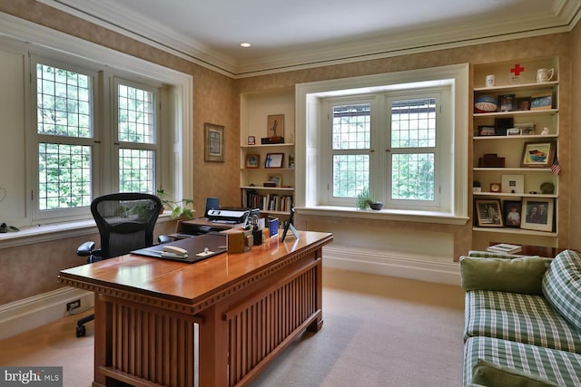 office featuring built in features, baseboards, carpet floors, and crown molding