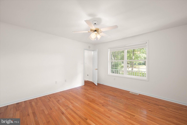 unfurnished room featuring ceiling fan and light hardwood / wood-style flooring