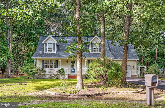 view of front of house featuring a front lawn and a porch