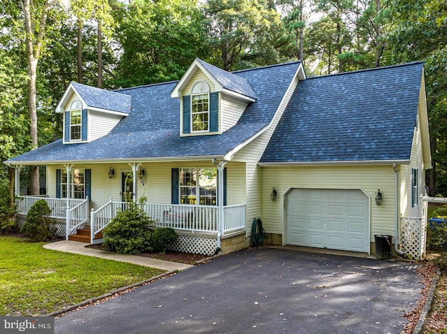 cape cod house featuring a garage and a porch