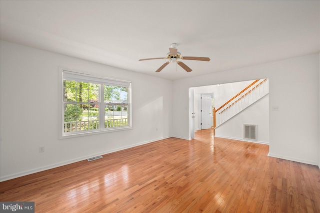 spare room featuring ceiling fan and light wood-type flooring