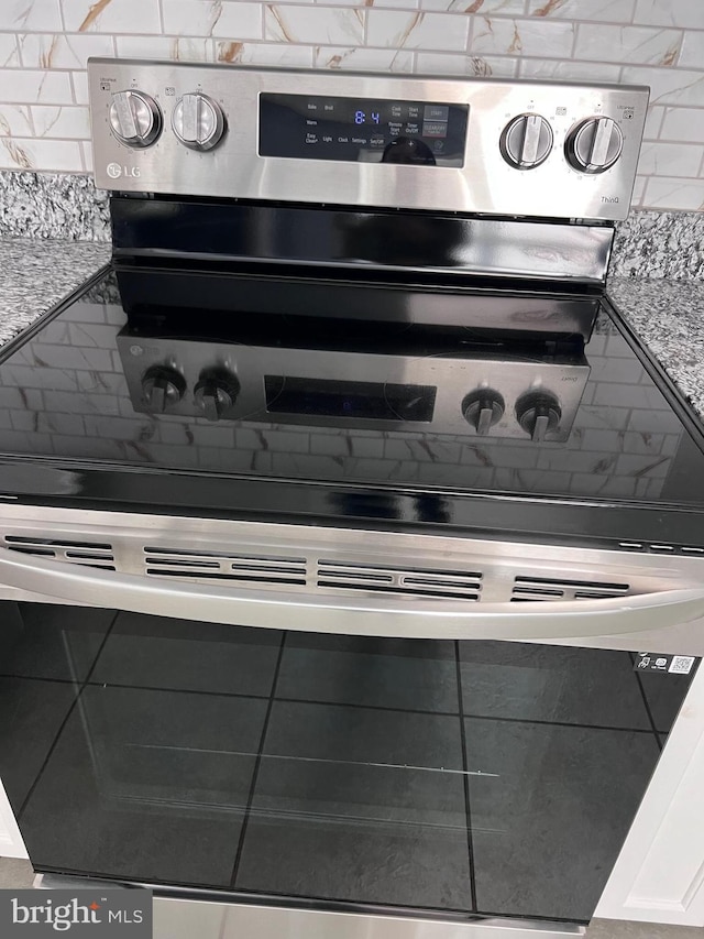 details with white cabinets and light stone countertops