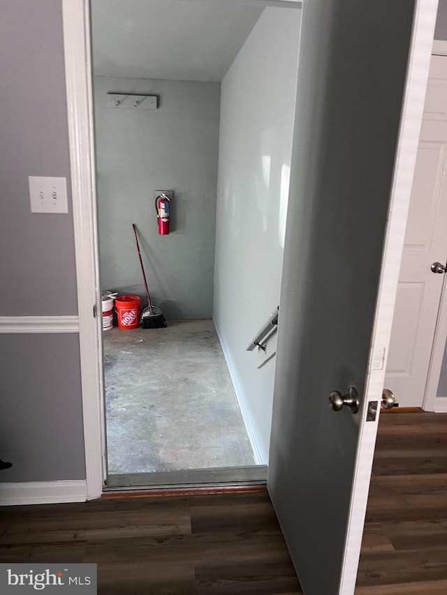 interior space featuring wood finished floors and baseboards