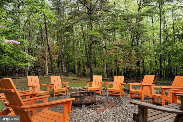 wooden deck with a fire pit