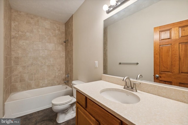 full bathroom with vanity, tiled shower / bath combo, toilet, and tile patterned flooring