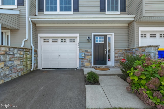 property entrance featuring a garage